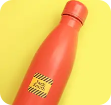 maxisticker label on orange bottle